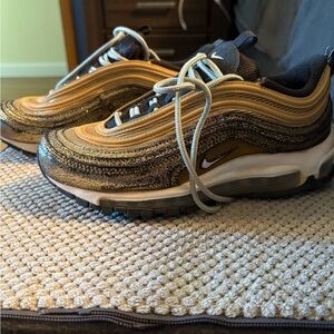 Nike Air Max 97 in Metallic Gold and Black